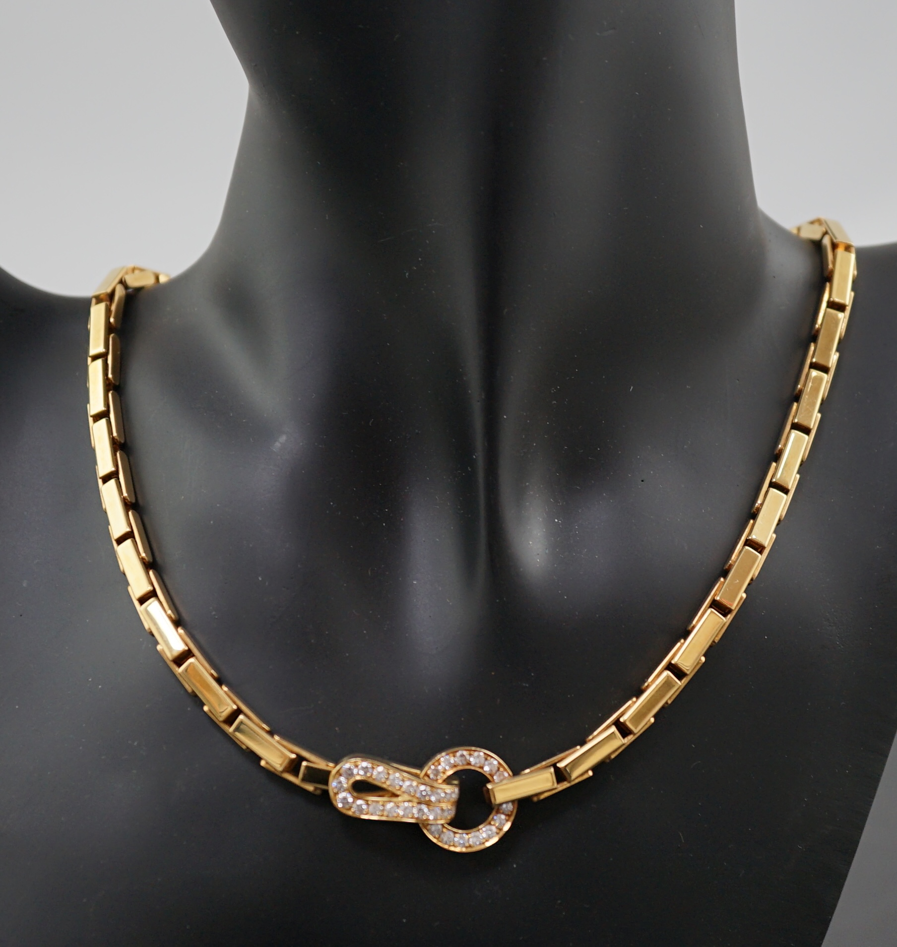 A modern Cartier 18ct gold necklace, with diamond cluster set clasp